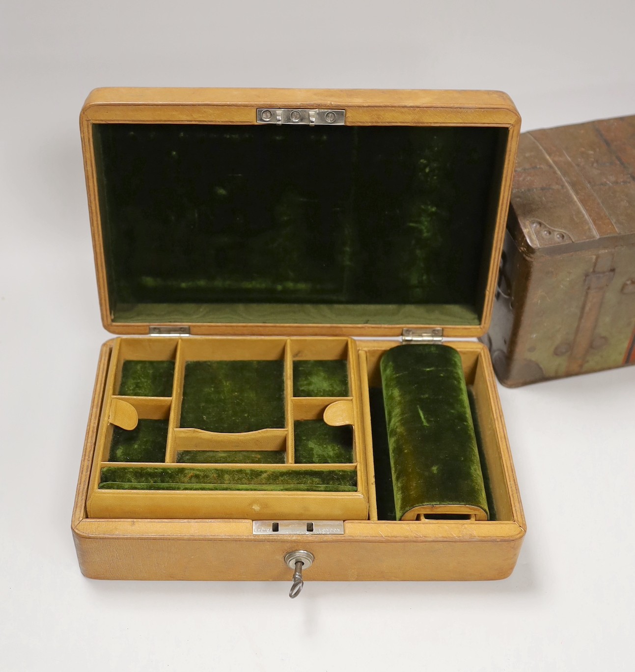 A leather Bramah jewellery case, a tortoiseshell cigarette box and a biscuit box. Widest 25.5cm